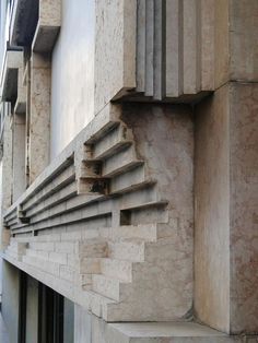 the corner of a building that has some stairs on it