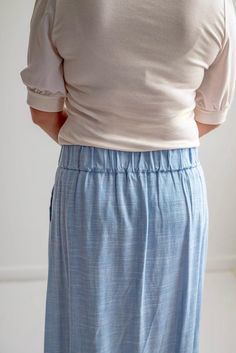 This lightweight skirt carries sophistication in its simplicity and is a lovely choice for so many warm weather outfits. Pair with a neutral blouse and flats for a casual day at the office or working around the house. This is one you'll choose to wear again and again - and you'll stay confidently covered since the mock-wrap won't blow open! Style: back elastic waist, mock-wrap linen skirt Fit: true to size Color: Light Blue Fabric content: 30% linen 70% viscose Care instructions: wash gentle cyc Casual Skirt With Elastic Waistband For Daywear, Casual Gathered Skirt For Daywear, Casual Long Skirt For Everyday Wear, Casual Daywear Midi Skirt, Casual Fitted Daywear Skirt, Casual Mini Skirt For Daywear, Casual Midi Skirt For Daywear, Spring Workwear Maxi Skirt With Elastic Waistband, Modest Bottoms With Elastic Waistband For Day Out