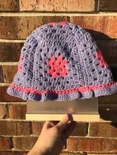 Just in time for spring, enjoy some pretty pastels with this adorable hat ✨ Made with 100% acrylic pink and purple yarn, hat will fit most standard sized heads with a little bit of stretch for adjustments as needed. This cutie really needs a noggin to show it off! Purple Granny Square, Granny Square Bucket Hat, Purple Yarn, Acrylic Pink, Chunky Beanie, Rainbow Prism, Chunky Crochet, Cute Hats, Bucket Hats