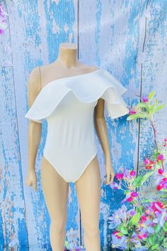 Chic bodysuit that you can match with almost anything. Limited sizes. Comes in small and medium. 100 % Polyester Hand Wash Cold. Fitted Bodysuit For Spring And Summer, Summer Short Sleeve Bodysuit With Lined Body, Elegant Short Sleeve Bodysuit For Summer, Spring One-piece Lined Bodysuit, Summer Bodysuit With Ruffles, Elegant Spring Short Sleeve Stretch Bodysuit, Fitted Summer Bodysuit With Lined Body, Stretch Bodysuit With Ruffles, Solid Color Ruffled Bodysuit For Summer