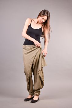 "Linen Harem Pants, Harem Trousers, Baggy Pants, Loose Pants. Extravagant harem trousers with interesting and unusual cut. The baggy pants are loose fit and feature drop crotch. The model is made of linen fabric so it is extremely comfortable women pants suitable for the daytime. If you are looking for the perfect addition to your casual outfit these loose pants are a great choice matched with flats or sneakers. ^ Sizes: The item can be made in sizes from XXS to 7XL. Please, use the size chart b Versatile Cotton Harem Pants With Loosely Fitted Hips, Baggy Khaki Ankle-length Pants, Versatile Stretch Cotton Harem Pants, Stretch Khaki Cargo Trousers, Khaki Baggy Ankle-length Pants, Loose Fit Full Length Khaki Pants, Versatile Harem Pants With Elastic Waistband, Versatile Cotton Ankle-length Harem Pants, Non-stretch Khaki Tapered Leg Pants