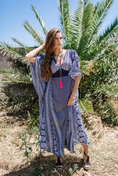 This Caftan style dress is the perfect, elegant wear that you can take to the beach or to wedding , depending on your accessories. This dress will make you feel like a Goddess ! Its shape enhances all body shapes with a gorgeous long lean figure. It is the perfect Resort , Holiday wear and is also very practical for your vacations. Its light weight fabric never wrinkles and it does not need and ironing ! Never ! its a total blessing ! Straight out of the washing machine ready to wear ! It has la Bohemian Printed Beach Dress For Festivals, Blue Printed Boho Dress For The Beach, Bohemian Maxi Dress For Beach Festival, Printed V-neck Beach Dress For Festivals, Blue Hippie Kaftan For Summer, Bohemian Maxi Dress For Festival Vacation, Blue Bohemian Dress With Kimono Sleeves, Bohemian Blue Dress With Kimono Sleeves, Traditional Blue Boho Dress For The Beach