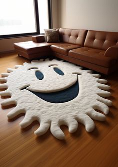 a living room with a large rug that looks like a smiling face