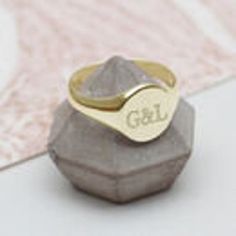 PRODUCT DESCRIPTION * A classic signet style ring personalised with the lucky recipients initials. * The perfect personalised gift. FREE GIFT BOX * Your order comes beautifully packaged in a free Hurleyburley gift box tied with a silk ribbon. We can add a gift card for your special message. FREE STANDARD UK DELIVERY * Our standard postage is by Royal Mail 1st class post which has delivery guidelines of 1-2 working days but is not guaranteed to arrive within this timeframe. * This item is availab Classic Engraved Ring With Hallmarks As Gift, Classic Engraved Ring With Hallmarks For Gift, Classic Rings With Engraving Option For Personalized Gift, Classic Initial Ring For Personalized Gift, Adjustable Initials Signet Ring For Wedding, Classic Engraved Ring For Personalized Gift, Oval Monogram Engraved Ring As Gift, Monogram Engraved Ring As Gift, Monogram Engraved Round Ring For Gift