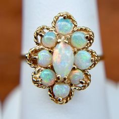 14KT Yellow Gold Multi Toned Opal Ring Size 7 Can be resized for an additional fee] Stamped 14K Very Good Condition Stunning, interesting piece Check out all our gemstone rings + our entire jewelry collection! Please let us know if you have any questions. Thank you, Legacy Saint Jewelry Unique Oval 14k Stamped Jewelry, Oval Cabochon Opal Multi-stone Jewelry, Heirloom 14k Gold Cabochon Jewelry, Collectible 14k Gold Gemstone Jewelry, Fine Jewelry Multi-stone Opal Jewelry, Multi-stone Opal Fine Jewelry, Opal Multi-stone Fine Jewelry, 14k Gold Cluster Jewelry With Birthstone, Antique White Multi-stone Jewelry