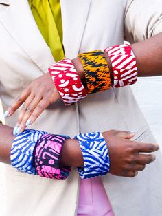 Large African Wax prints bangles Compliment the look with these handmade African bangles. Made with light wood and Traditional African wax print. PS: These bangles fit wide/ Large. So, wouldn't fit slimer wrists Colour: multi pattern prints Details: . Handmade item . Wide fit . Bracelet width: 5 Cm . Weight: 38g . Materials: Wood and cotton prints . Style: colourful Please note that this item needs to be removed prior to showering, swimming or anything that could result in the fabric being damag Handmade Yellow Cuff Bracelet, Multicolor Hand Painted Bangle Bracelets, Multicolor Hand Painted Bangle Bracelet, Hand Painted Multicolor Bangle Bracelet, Multicolor Hand Painted Bangle, Hand Painted Multicolor Bangle, Handmade Multicolor Bangle, African Bangles, Fabric Bangles