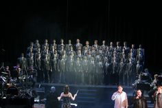 a group of people standing on top of a stage