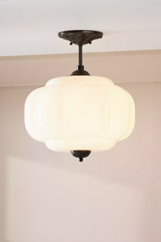 a light fixture hanging from the ceiling in a room