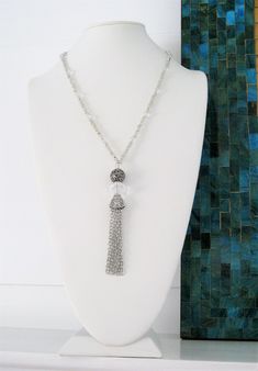 "Four different styles of silver beaded tassel necklaces to choose from, designed and handmade by Ralston Originals. I made all the tassels with silver chains, and covered each in a beautiful antique silver metal bead cap. The first beaded necklace (Pictures 1-3), is made with a very unique and beautiful large silver bead, with many tiny crystal inlaid accents. The necklace is also made with a large antique silver crystal roundel, and a large clear crystal bead. The beaded chain on the necklace Adjustable Long Tassel Necklace With Dangling Beads, Handmade Silver Long Tassel Necklace, Adjustable Tassel Necklace With Dangling Beads As Gift, Adjustable Tassel Necklace With Dangling Beads For Gift, Adjustable Beaded Chain Tassel Necklace As Gift, Elegant Silver Beaded Tassel Necklace, Beaded Dangle Tassel Necklace For Gift, Beaded Tassel Dangle Necklace For Gifts, Tassel Necklace With Round Beads For Gifts