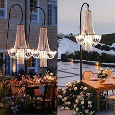 an outdoor dining area with flowers and chandeliers