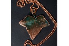 Original, unique and exclusive handmade beautiful copper jewelry pendant ivy leaf with a turquoise patina for a gift to a woman , Jewelry necklace in size 56/57 mm Elegant Patina Necklaces As Gift, Elegant Patina Necklaces For Gifts, Green Patina Pendant Jewelry, Green Pendant Jewelry With Patina, Copper Jewelry With Patina As A Gift, Copper Jewelry With Patina For Gifts, Elegant Patina Pendant Necklace, Elegant Pendant Necklace With Patina, Handmade Bronze Leaf Jewelry