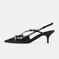 Elevate your style with these chic Women's Black Slingback Pumps. Featuring a pointed toe, strappy design, and comfortable kitten heels, these shoes are perfect for any sophisticated outfit. Heel height: 2.16 inches/ 5.5 cm Low heels for comfortable wear. Buckled strappy detailing. Slingback style for a secure fit. Elegant and stylish look. Suitable for both casual and formal outfits. Chic Slingback Pumps With Straps, Kitten Heels With Heel Strap For Night Out, Black Single Toe Strap Kitten Heels For Spring, Black Kitten Heels With Single Toe Strap For Spring, Chic Kitten Heels With Heel Strap And Toe Strap, Slingback Kitten Heels With Heel Strap For Night Out, Chic Black Kitten Heels With Single Toe Strap, Chic Kitten Heels With Heel And Toe Straps, Low Heel Slingback Pumps For Night Out