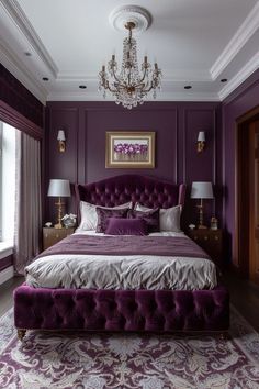 a bedroom with purple walls and a chandelier hanging from the ceiling, along with an upholstered bed