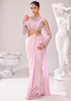 Our beguiling semi ethnic saree makes a dreamy walk at any occasion. Encapsulate the detailed embellishments in this rhythmic silhouettes that translate to everyday poetry. Pearl is a significant element of this collection and so with other elements, highlights the sleeves and border of the saree. The blouse has a halter neck with cold shoulder sleeves. The ring goes in the center highlighting the drape of the saree. Punjabi Dress Design, Ethnic Saree, Punjabi Dress, Ethnic Sarees, Indian Clothing, Western Wedding, Wedding Service, Bride Bridal, Black Bow