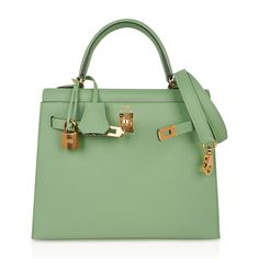 Guaranteed authentic Hermes Kelly Sellier 25 bag featured in fresh Vert Criquet. Stunning Hermes light green that is absolutely neutral. Luxurious with gold hardware. Comes with signature Hermes box, raincoat, shoulder strap, sleepers, lock, keys and clochette. NEW or NEVER WORNThe Hermes Kelly Sellier 25cm bag price retains its value due to the rarity and high demand. As a purveyor of exceptional and unique Hermes luxury goods, mightychic raises the bar of online shopping.final sale BAG MEASURE Luxury Green Satchel With Handles, Classic Green Satchel With Branded Hardware, Green Rectangular Satchel With Branded Hardware, Luxury Green Bags With Lock, Luxury Green Bag With Lock, Rectangular Green Satchel With Branded Hardware, Green Shopping Bag With Branded Hardware, Designer Green Satchel With Branded Hardware, Classic Green Bag With Gold-tone Hardware