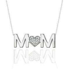 Express your love and affection for your mother with our MOM Moissanite Pendant Necklace in 18K White Gold over Silver on this Mother's Day. Carefully crafted to perfection, this moissanite necklace includes 0.20 Carat round cut moissanite in 18K White gold over the silver. The chain of this beautiful moissanite chain for sale is white and 18 inches long. With the graceful pendant on the sturdy chain, this item is the perfect Mother's day gift. If you are looking for a Mother's Day gift idea, then look no further! This mothers day necklace is an incomparable and affordable beauty. With its extraordinary design and the meaning it holds, this moissanite necklace is the perfect way to express your unconditional love for your mother on this Mother's day. Make her feel special with this moissan Personalized Diamond Jewelry For Mother's Day, Diamond Accented Jewelry For Anniversary On Mother's Day, Mother's Day Anniversary Jewelry With Diamond Accents, Diamond Jewelry Gift For Mom, Elegant Necklace With Diamond Accents For Mom, Mother's Day White Gold Cubic Zirconia Jewelry, Diamond Birthstone Jewelry As Gift For Mom, Diamond Birthstone Jewelry For Mom, Diamond Jewelry For Mom On Valentine's Day