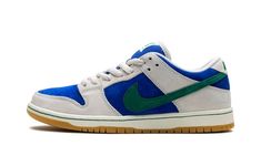 The Nike SB Dunk Low “Hyper Royal/Malachite” is a colorway of the skateboarding shoe with a can’t-miss color scheme.  Made for skateboarding or casual wear, the SB Dunk Low “Hyper Royal/Malachite” comes in eye-catching colors, with Hyper Royal suede appearing on the base and Phantom-colored suede appearing on the overlays.  A Malachite suede Swoosh logo is seen on the sides.  More Malachite accenting appears on the “Nike” embroidery on the heel and on the branding on the tongue tag.  A gum rubbe Green Custom Sporty Sneakers For Skateboarding, Green Sporty Custom Sneakers For Skateboarding, Sporty Green Custom Sneakers For Skateboarding, Nike Skate Shoes With Gum Sole For Skateboarding, Nike Green Skateboarding Sneakers, Green Vulcanized Sole Sneakers For Skateboarding, Green Low-top Custom Sneakers For Skateboarding, Green Skate Shoes With Gum Sole For Streetwear, Green Skate Shoes With Boost Midsole