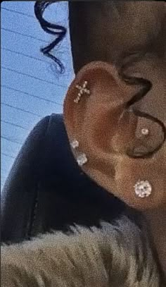 a person with ear piercings on their ears