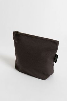 If you’ve been looking for an eco-friendly makeup bag to tame and organize cosmetic items, consider the simple and affordable Lok Pouch. Made from sustainably grown organic cotton canvas, the Lok Pouch’s dimensions (7" X 9" x 3" ) are large enough to accommodate most cosmetic containers and accessories but small enough to easily toss into a larger tote or pack. It has a 7-inch zippered opening with a long pull and a gusseted bottom panel, so it stands up on the countertop for easy access. Conten Eco-friendly Canvas Pouch Bag For Everyday, Eco-friendly Canvas Bag With Removable Pouch For Everyday Use, Eco-friendly Cotton Canvas Bag With Removable Pouch, Eco-friendly Canvas Shoulder Bag With Removable Pouch, Cheap Eco-friendly Bags With Zipper Pouch, Eco Friendly Makeup, Cosmetic Containers, Cosmetic Items, Large Tote