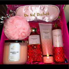 a pink box filled with lots of different types of beauty products and items in it