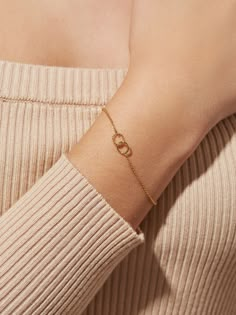 This dainty bracelet featuring interlocking circles is crafted in 100% recycled Sterling Silver and dipped in 14k gold. Adjustable and lightweight, this interlocking circles bracelet features one ring with a smooth finish and a second one with a subtle twisted design, making it a versatile and timeless jewelry staple. A matching necklace is available here.  14k gold on 100% recycled Sterling Silver Dainty & lightweight chain bracelet  Adjustable size & perfect to stack with other bracelets Aesthetic Gold Ring Designs, Dainty Jewellery Aesthetic, Aesthetic Breslet, Dainty Chain Bracelet, A Bracelet Gold, Dainty Silver Jewellery, Silver Bracelet Design For Women, Hand Bracelet Gold For Women, Bracelet Aesthetic Gold