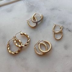 If you're looking for understated glam wrapped up in a all day-everyday essential, then you've found the perfect hoops! Our Ziggy Gold Hoops are THE must have for every look. These hoops will never lose their diamond cut luster. The perfect size and width for main character energy or layering with larger pieces. Always 14K Gold!

Size: 20mm (approx. 0.80" Inches) Diameter - 3mm (W)

Sold As PAIR
Ear Hook Snap Closure
Solid 14K Gold
Lifetime Guarantee
Made in Los Angeles Timeless Earrings, Oval Hoop Earrings, Shades Of Gold, Gold Piece, Earring Sale, Ear Hook, Main Character, Gold Hoops, Personalized Necklace