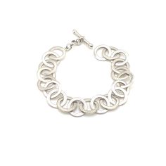 I am so happy to have come across a beautiful example of Canadian modern jewelry! This silver bracelet features a toggle closure and circle chain links. The piece is in excellent estate condition, showing minimal wear. Thank you so much and happy shopping! Modern Chain Bracelet With Toggle Clasp For Everyday, Modern Sterling Silver Chain Bracelet With Lobster Clasp, Modern Sterling Silver Bracelet With Toggle Clasp, Modern Link Sterling Silver Bracelet With Toggle Clasp, Modern Oval Link Bracelet With Toggle Clasp, Everyday Chain Bracelet With Toggle Clasp, Everyday Silver Bracelet With Toggle Clasp, Everyday Sterling Silver Bracelet With Toggle Clasp, Modern Sterling Silver Round Chain Bracelet