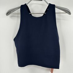 Quince Women's Ultra-Soft Performance Cropped Tank - New With Tags Color: Navy Blue Size: Xs 84% Recycled Polyester, 16% Spandex Quick-Dry Moisture-Wicking Anti-Microbial 4-Way Stretch Measurements 13" Pit-To-Pit, Laying Flat 12.5" Length 13" Waist, Laying Flat Blue High Stretch Racerback Sports Bra, High Stretch Blue Racerback Sports Bra, Blue Sleeveless Activewear With Seamless Construction, Blue Seamless Tank Top With Medium Support, Blue Tank Top With Seamless Construction And Medium Support, Blue Medium Support Tank Top For Gym, Blue High Stretch Sports Bra, Blue Sleeveless Moisture-wicking Sports Bra, Supportive Blue Gym Tank Top