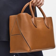 Find ASPINAL OF LONDON Leather Tan Midi Tote Bag on Editorialist. Simple and understated, our signature Midi London Tote is aversatile everyday companion.Handcrafted from the finest full-grain leather, itssemi-structured shape is instantly recognisable with the twostitched 'A' panels to the sides, accented by our signature shieldand plaque charms.This must-have leathertote bag can be carried by the soft top handles or worncross-body using the detachable soft leather strap, which can bepersonalis London Bags, Aspinal Of London, Frame Bag, Orange Bag, Tote Bag Leather, Red Suede, Black Tote Bag, Leather Tote Bag, Leather Material