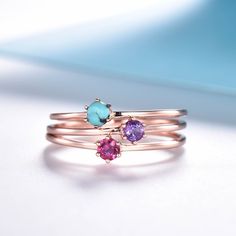 You are looking at a dainty birthstone ring. Stackable wedding band,matching band.A perfect anniversary gift, birthday gift,wedding engagement ring.Great as a gift for her. Ring Information Stones * Size: 3mm round *Lab created opal *Turquoise *Tourmaline *Moonstone *Amethyst *If you need other birthstone, please fell free to contact me :) Metal * Solid 10k 14k &18k. *Color:white gold,yellow gold,rose gold. Custom Order *The main stone can be other gemstones you can imagine,any birthstone ca Rose Gold Sterling Silver Birthstone Promise Ring, Rose Gold Birthstone Ring With Round Cut, Adjustable Rose Gold Sterling Silver Birthstone Ring, Rose Gold Sterling Silver Stackable Rings With Birthstone, Adjustable Rose Gold Birthstone Ring With Round Band, Rose Gold Stackable Gemstone Rings, Adjustable Rose Gold Stackable Rings Round Cut, Rose Gold Crystal Ring With Birthstone In Sterling Silver, Rose Gold Solitaire Birthstone Ring With Open Design