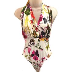 Glamazon Halter Bodysuit Floral White Size Medium Preowned: Never Worn Multicolor Fitted V-neck Swimwear, Amazon Sleeveless Swimwear For The Beach, Fitted Sleeveless Swimwear By Amazon, Fitted Floral Print One-piece Bodysuit, Multicolor Stretch V-neck Bodysuit, Spring Multicolor Bodysuit For Poolside, Floral Print Fitted Bodysuit, Fitted Floral Print Bodysuit, Fitted V-neck Floral Print Bodysuit