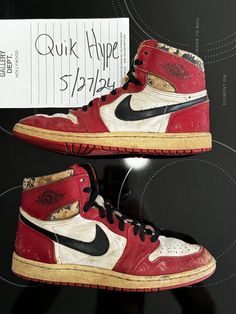 This Nike Air Jordan 1 Chicago sneaker, released in 1985, is a highly sought-after item among collectors and sneaker enthusiasts. The shoe features a striking red and white colorway, with the iconic Nike swoosh on the side and Air Jordan logo on the tongue. The size 9 shoe is in used condition and has been previously worn, with signs of wear and tear. Whether you're a collector or simply a fan of vintage sneakers, this Air Jordan 1 is a must-have addition to any collection. NOT WEARABLE. Original black laces 1985 Jordan 1, Nike Air Jordan 1 Chicago, Air Jordan Logo, Air Jordan 1 Chicago, Jordan Logo, Vintage Sneakers, Nike Air Jordan 1, Nike Swoosh, Black Laces