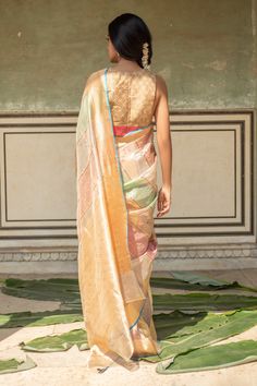 Blush, sage green saree with floral buttas woven motifs and gold pallu. Comes with running blouse piece.
Components: 1
Pattern: Woven
Type Of Work: Floral buttas
Fabric: Silk Chanderi
Color: Pink,Green
Other Details: 
Note: Stitched blouse worn by the model is not for sale
Disclaimer: The joint fabric pieces may vary. Designers unique process ensures that the placement of fabric will always be similar but not same. They always create the product with stretch fabrics of similar types and weights Sage Green Saree, Chanderi Saree, Green Saree, Handmade Textiles, Blouse For Women, Fabric Silk, Blouse Online, Pink Blouse, Pink Silk