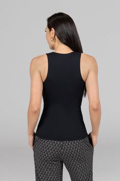 Why we love this: Bold & beautiful. With a built-in bra and a sexy halter top design, this top will make you feel effortlessly flawless no matter where you day may take you! Features: KiraGrace Luxe: Feels ultra-soft and luxurious Medium compression: Form fitting for moderate support Perfect from the studio to the streets Double-layer shelf bra for support. Need removable bra cups? Made in USA of imported fabric FIT: Form-fitting, hip-length tank that stays put COVERAGE: Halter neckline for maxi Layer Shelf, Yoga Tank Top, Travel Pants, Yoga Tank, Yoga Tank Tops, Yoga Tops, Top Design, Shelf Bra, Halter Neckline