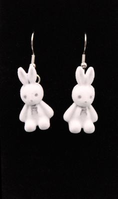 Add a touch of whimsy to your jewelry collection with these adorable Bunny Earrings. Perfect for those who love unique and playful accessories, these earrings are sure to bring a smile to your face with their charming design and comfortable wear. Product Details: Material: Soft, fuzzy material for the bunny shapes, complemented by durable stainless steel hooks. Weight: Lightweight at just 0.30oz, ensuring a comfortable wear experience. Length: 1.5 inches, providing a noticeable yet manageable ac Whimsical White Drop Earrings, Handmade Adjustable Kawaii Earrings, Novelty White Dangle Earrings, Novelty White Drop Earrings, White Novelty Drop Earrings, Playful Hypoallergenic Dangle Earrings, Cute Single Sterling Silver Earring, White Fun Dangle Earrings, Adjustable Kawaii Dangle Earrings