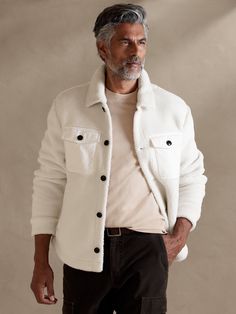 When shirt meets sweater, a cozy legend is born.  Using an effortlessly cool button-down silhouette, we added chest and side welt pockets to keep the top functional.  Pair it with our matching joggers for a look that is both athletic and at-ease.  Po White Coat Outfit Men, Off White Jacket Outfit Men, Cream Overshirt Outfit Men, White Overshirt Men Outfit, Cozy Tops With Side Pockets For Fall, Winter Relaxed Fit Button-up Tops, Casual Fleece Jacket With Side Pockets For Winter, Casual Winter Fleece Jacket With Side Pockets, Casual Collared Outerwear With Button Cuffs