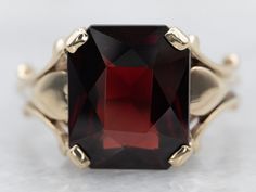 "This beautiful ring is crafted in yellow gold and set with a single garnet gemstone. A timeless classic, its elegant design is perfect for any occasion. The ring is set on a smooth shank, enhancing the stunning design. Metal: 10K Yellow Gold Gem: Garnet 4.33 Carats Gem Measurements: 9.1 x 11.0 mm, Emerald Cut Ring Size: 7 Marks: \"DASON 10K\" Stamped on the inside band SKU #: A29848 Each piece has been identified and graded by a Graduate Gemologist who has been certified by the Gemological Inst Purple Sapphire Ring, Emerald Cut Ring, Sapphire Solitaire Ring, Emerald Cut Rings, Sapphire Solitaire, Purple Sapphire, Garnet Ring, Gold Gift, Blue Zircon