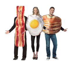 three people are dressed up as breakfast characters and one is holding a bacon pancake