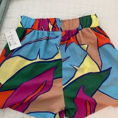 High Waist Vibrant Color And New With Tags. Fun Vacation Bottoms With Built-in Shorts, Casual Bottoms With Built-in Shorts For Beach Party, Multicolor Beachwear Shorts For Summer Outings, Blue Tropical Print Beachwear Shorts, Trendy Green Shorts For Vacation, Trendy Green Vacation Shorts, Blue Tropical Shorts For Summer, Casual Short Bottoms For Beach Party, Multicolor Shorts For Summer Outings