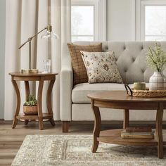 a living room scene with focus on the couch and coffee table in the foreground