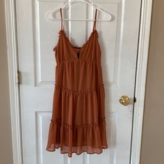 Hayden Nwt Rust Colored Ruffled Mini Dress Cute Tie Front Size:Large Casual Chiffon Sundress With Ruffles, Casual Ruffle Dress For Date Night, Flowy Brown Tiered Dress, Flowy Tiered Brown Dress, Brown Ruffle Hem Dress For Vacation, Chiffon Ruffle Sundress For Day Out, Casual Tiered Chiffon Mini Dress, Brown Ruffle Hem Dress For Beach, Brown Ruffled Midi Dress