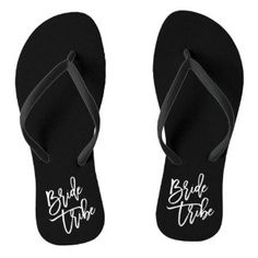 a pair of black flip flops with the monogrammed initials