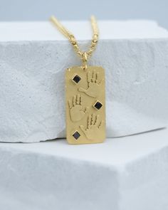 Handprints / Footprints Coin Dog Tag Necklace in solid 14k yellow or white gold with black diamonds made using your loved ones’ actual prints. We can substitute diamonds for other stones (sapphire, ruby etc). We can work either with handprints / footprints you already have or we can provide a simple Print Kit so you can take your prints easily at home. Each piece is made to order in our studio in New York. Every piece of our jewelry comes in our signature Matanai packaging, complete with a polis Yellow Gold Necklace With Black Diamonds As Gift, Fine Jewelry Gold Jewelry With Black Diamonds, Fine Jewelry With Black Diamonds In Gold, Fine Jewelry In Gold With Black Diamonds, Fine Jewelry Gold With Black Diamonds, Baby Handprint, Personalized Gifts For Dad, Keepsake Jewelry, Black Diamonds