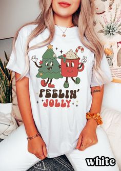 "Comfort Colors Christmas Shirt, Christmas Shirts for Women, Christmas Tree, Christmas T-Shirt, Merry Christmas Shirt, Cute Christmas Gift Save by bundling! We offer these great discounts on bulk orders: - 25% on 5+ items (use code BUNDLE5) - 30% on 10+ items (use code BUNDLE10) - 35% on 20+ items (use code BUNDLE20) ➭ How to Order 1. Choose your shirt size & color options. 2. Select the quantity. 3. Click \"Add to Cart.\" 4. Listen for a knock at your door! ➭ Care Instructions Wash your shirt i Cute Christmas Tshirts, Funny Holiday T-shirt With Graphic Print, Holiday White T-shirt With Graphic Print, Fun Winter T-shirt With Crew Neck, White Casual Christmas T-shirt, Casual White Christmas T-shirt, Holiday Graphic Tee With Funny Print, White Casual T-shirt For Christmas, Casual White T-shirt For Christmas