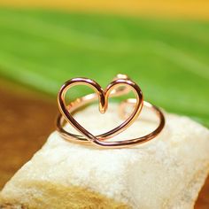 "This minimalist heart ring, adjustable, is shown in copper, but can also be made in sterling silver filled*. ~ The dainty heart itself measures 4/8\"x5/8\". ~ Each ring will be handmade by me for you, and each one will be unique. ~ Wear it as a classic finger ring, or a knuckle ring. Cute gift for your girlfriend, or to the bridesmaids at your wedding. *Sterling silver filled wire is a high-quality wire product, fabricated with an everlasting thick outer layer of sterling silver, bonded to (or Adjustable Nickel-free Heart Promise Ring, Dainty Adjustable Open Heart Rings, Adjustable Open Heart Promise Jewelry, Adjustable Minimalist Open Heart Ring, Minimalist Adjustable Open Heart Ring, Handmade Adjustable Heart Ring For Promises, Adjustable Minimalist Heart Ring For Promise, Adjustable Heart-shaped Midi Promise Rings, Delicate Adjustable Heart Promise Ring