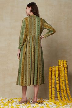 This ethnic outfit and shrug ensemble is the perfect marriage of traditional Indian craftsmanship and modern fashion. Made of breathable fabrics and adorned with intricate mirror work details and tassels, it combines comfort and style in a timeless classic. This Fusion Wear Green Outfit with Shrug is perfect for a casual, comfortable look. Its fabric is designed to provide superior fit and comfort, while its neat tailoring ensures a flawless look. Make a timeless fashion statement in this exquis Bohemian Chanderi Anarkali Set For Eid, Festive Green Kurta With Tassels, Multicolor Straight Kurta With Tassels, Traditional Designer Kurta With Back Tassel Tie-up, Festive Multicolor Kurta With Tassels, Navratri Straight Kurta Anarkali Set With Tassels, Bohemian Straight Kurta Anarkali Set, Traditional Anarkali Set With Tassels For Designer Wear, Festive Kurta With Back Tassel Tie-up For Eid