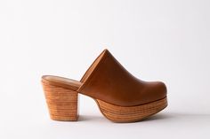 Meet your new best friend, Ava. She's a mule, with a twist! Her clog-inspired platform gives you an extra lift and her soft leather upper will hug your foot in all the right places. Dress her up or down, Ava is the perfect shoe to throw on in any type of weather. Handmade in Peru. This style runs true to size. If you're in between sizes, we recommend sizing up. Heel Height 3" Platform Height1.125" MaterialsUpper: leatherInsole: leatherOutsole: leather-wrapped wood platform with rubberHeel: leath Whiskey Cream, Black Whiskey, Women's Clogs, New Best Friend, Wooden Heel, Womens Clogs, Perfect Shoes, Rubber Heels, Handmade Shoes