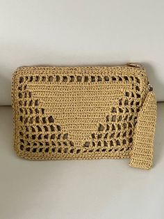 I made this beautiful clutch from raffia  This bag is light weight yet durable, breathable and environmental at the same time.  ELEGANT HIGH QUALITY CLUTCH Measurements:31x22 cm Color:Camel Lining:Yes Shipment  Process Time:3 business days Delivery Time:varies by country please see my shipping policy Any woman must have this bag for every fashionista.Whether you keeping it to yourself or gifting someone you care, it will be unforgettable. Perfect for all occasions, such as beach, party, camping, Beige Rectangular Beach Clutch, Gold Rectangular Beach Clutch, Woven Pouch Clutch As Gift, Woven Rectangular Clutch In Natural Color, Cream Woven Clutch For Beach, Rectangular Woven Clutch In Natural Color, Beige Bohemian Clutch Pouch, Natural Woven Rectangular Clutch, Bohemian Beige Clutch Pouch