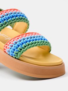 The most authentic and colorful version of the Road. The MULTICOLOR GALDANA sandals have a dose of color that makes them the most desired by everyone this season. Their woven details in shades of green, blue, and orange express the essence of summer. Their molded insole, elevated rubber soles, and open-back silhouette make them perfect for walking around your favorite city, going to work, or meeting up with your friends. Ideal for adding a pop of color to any outfit, pair them with the Macarella Spring Green Sandals With Woven Sole, Green Sandals With Woven Sole For Beach, Green Flat Sandals With Woven Sole, Green Open Toe Sandals With Woven Sole, Multicolor Sandals With Removable Insole For Summer, Multicolor Synthetic Sandals For Summer, Multicolor Synthetic Summer Sandals, Multicolor Sandals With Cushioned Footbed For Vacation, Multicolor Woven Open Toe Sandals