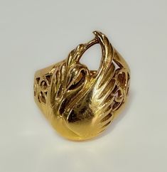 Art Nouveau c1930s This beautifully made Nouveau era ring, with a few Victorian elements - a fine example of transitional design. The details I. The Swan are fluid and very pretty. The scroll work is clearly hand wrought. An elegant piece. 5.6g 14k solid yellow gold Hallmarked Swan measures 19 x 13mm Shank tapers from 9mm to 3mm S 6.5 US resizable Very fine antique condition Art Nouveau Yellow Gold Round Ring, Art Nouveau 14k Gold Rings As Gift, Art Nouveau Yellow Gold Jewelry For Anniversary, Art Nouveau Yellow Gold Collectible Rings, Yellow Gold Art Nouveau Jewelry For Anniversary, Collectible Art Nouveau Yellow Gold Ring, 14k Gold Art Nouveau Rings As Gifts, Vintage Gold Jewelry With Artistic Design, 14k Gold Art Nouveau Ring Jewelry